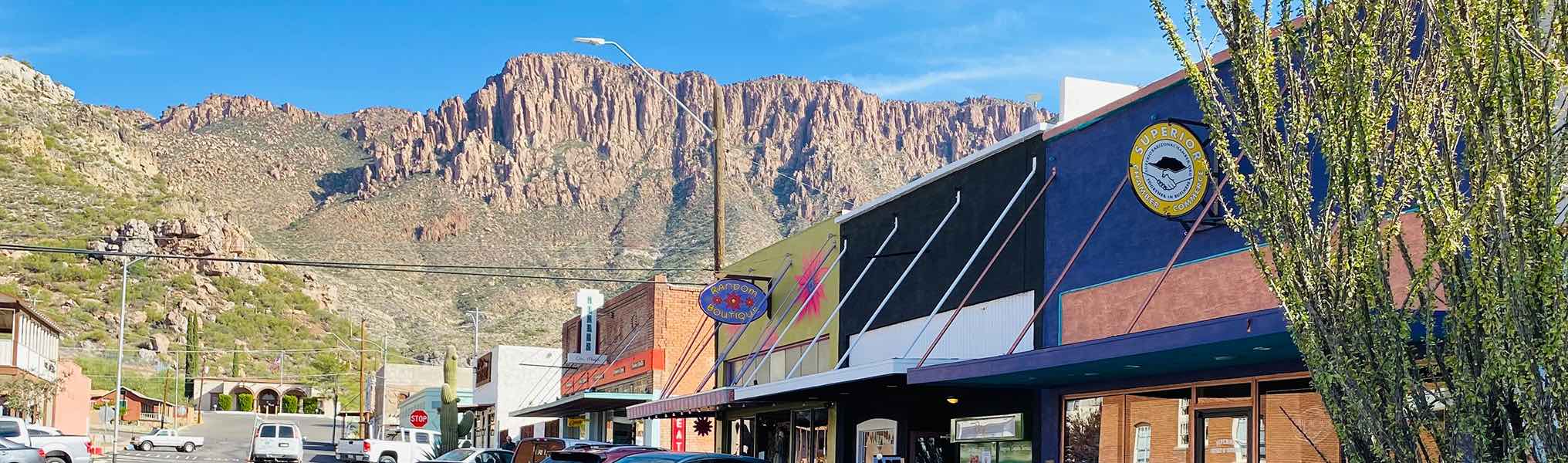 A city street with a mountain backdrop in Superior, AZ.